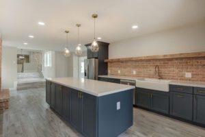 A kitchen with two sinks and a large island.