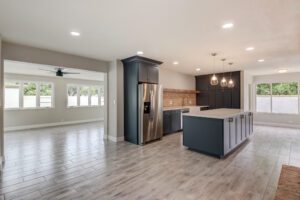 blue shaker kitchen cabinets with wood look tile floor