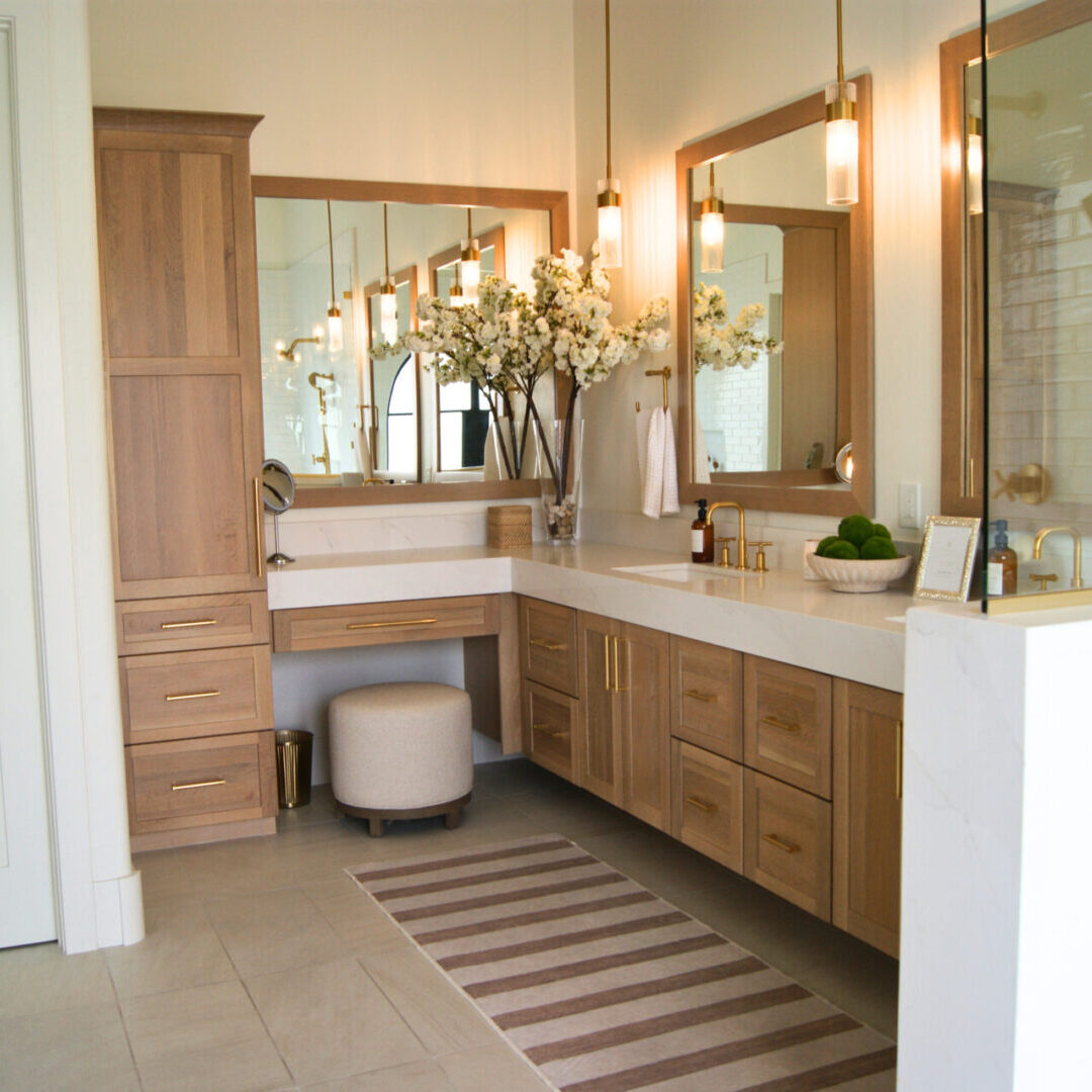 A bathroom with two sinks and mirrors in it