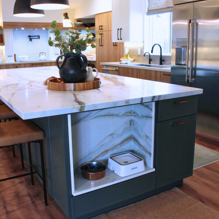 A kitchen with an island and wooden floors