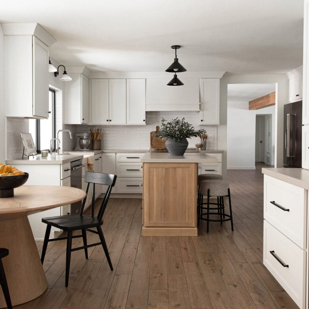 transitional kitchen, white shaker perimeter with a quartersawn white oak island, quartz countertops and wood look tile floor