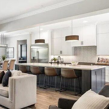 A living room with a couch and chairs in it