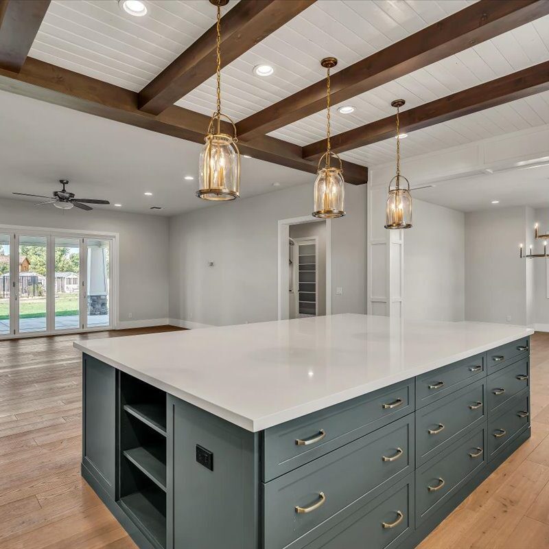 A large kitchen with a big island in the middle of it